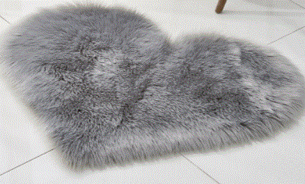 Tapis moelleux en forme de coeur